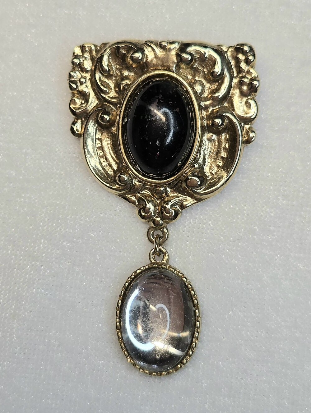 Source Unknown Gold-Tone Brooch with Black and Clear Cabochons